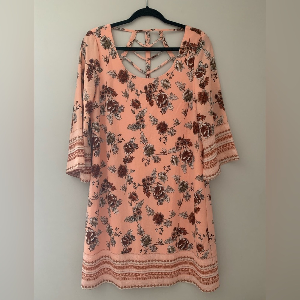 NEW WITH TAGS. Coral floral dress with unique back.
